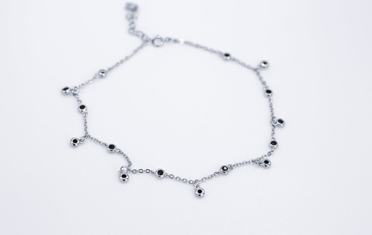 Anklet with black stones