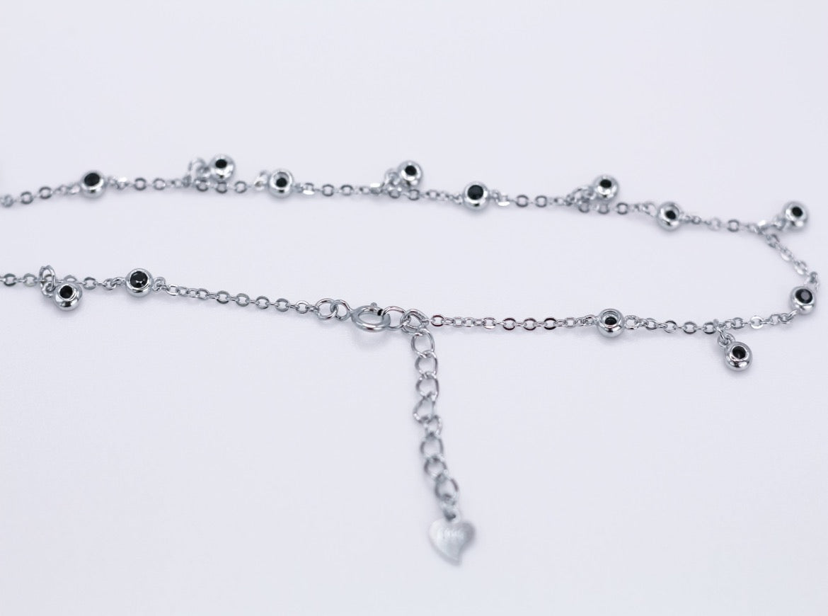 Anklet with black stones