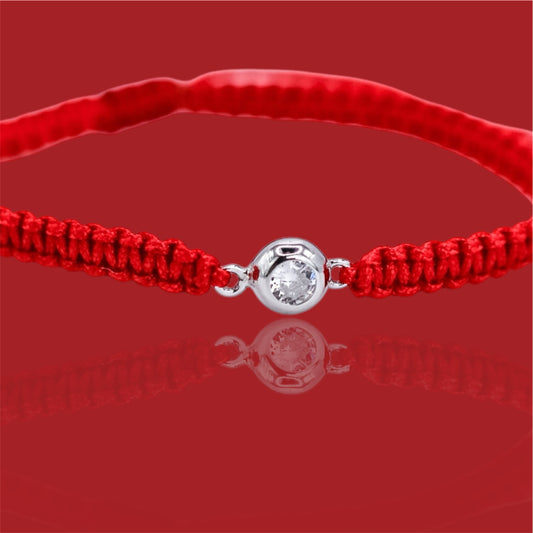 Bracelet on a red thread with a Zirconia stone