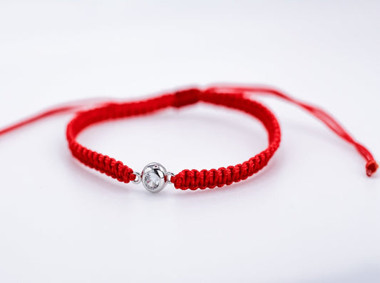 Bracelet on a red thread with a Zirconia stone